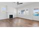 Bright living room with hardwood floors, a fireplace, and large windows at 103 2Nd Nw Ave, Hickory, NC 28601