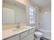 Full bathroom with white vanity, bathtub, and shower at 165 Smokey Way, Statesville, NC 28625