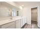 Main bathroom with double vanity, white cabinets and walk-in shower at 165 Smokey Way, Statesville, NC 28625