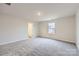 Spacious bedroom with gray carpeting and large window for natural light at 165 Smokey Way, Statesville, NC 28625