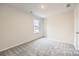 Bright bedroom with gray carpeting and a window at 165 Smokey Way, Statesville, NC 28625