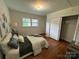 Cozy bedroom with hardwood floors, comfortable bedding, and closet at 1727 Hartford Dr, Gastonia, NC 28052