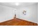 Well-lit bedroom featuring hardwood floors at 1727 Hartford Dr, Gastonia, NC 28052