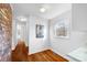 Bright kitchen features hardwood floors and a view to the hallway at 1727 Hartford Dr, Gastonia, NC 28052