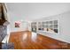 Spacious living room featuring hardwood floors and fireplace at 1727 Hartford Dr, Gastonia, NC 28052