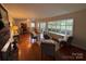 Comfortable living room featuring a cozy seating area, fireplace, and ample natural light at 1727 Hartford Dr, Gastonia, NC 28052