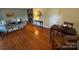 Spacious living room featuring hardwood floors and multiple seating areas, perfect for entertaining at 1727 Hartford Dr, Gastonia, NC 28052