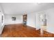 Hardwood floors, fireplace, and view into kitchen at 1727 Hartford Dr, Gastonia, NC 28052