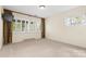 Spacious bedroom with large windows, carpet, and window shutters at 423 Whitestone Rd, Charlotte, NC 28270