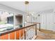 Hallway view with orange brick and staircase at 423 Whitestone Rd, Charlotte, NC 28270