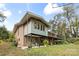 Ranch style home with a brick facade and mature trees at 423 Whitestone Rd, Charlotte, NC 28270