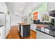 Kitchen features a butcher block island and green painted walls at 423 Whitestone Rd, Charlotte, NC 28270