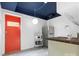 Small kitchen with orange door, microwave, and a sink at 423 Whitestone Rd, Charlotte, NC 28270