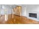 Living room with hardwood floors, built-in shelving, and fireplace at 423 Whitestone Rd, Charlotte, NC 28270