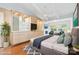 Main bedroom with hardwood floors and a large built-in storage unit at 423 Whitestone Rd, Charlotte, NC 28270