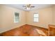 Sunny bedroom with hardwood floors, neutral walls, and bright windows offering a cozy space at 802 E Harrison Ave, Gastonia, NC 28054