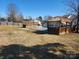 Spacious backyard featuring a wooden deck, covered patio, and inviting swimming pool at 8540 Indian Summer Trl, Harrisburg, NC 28075