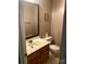 Clean bathroom with a vanity, toilet, and mirror at 8540 Indian Summer Trl, Harrisburg, NC 28075