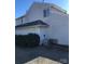 Rear view of house, showcasing vinyl siding and landscaping at 8540 Indian Summer Trl, Harrisburg, NC 28075