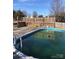 Backyard swimming pool with wooden deck and diving board at 8540 Indian Summer Trl, Harrisburg, NC 28075