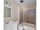 Bathroom featuring a shower-tub combo and vanity at 1018 Carysbrook Ln, Charlotte, NC 28217