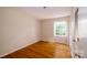Bright, airy bedroom featuring hardwood floors and natural light at 1018 Carysbrook Ln, Charlotte, NC 28217