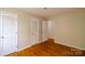 Spacious bedroom featuring hardwood floors and closet space at 1018 Carysbrook Ln, Charlotte, NC 28217