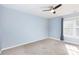 This bedroom is a blank canvas featuring a ceiling fan, carpet, and a light blue wall color at 137 Huntfield Way, Mooresville, NC 28117