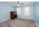 Bright bedroom featuring carpet, desk, ceiling fan, and a windows offering natural light at 137 Huntfield Way, Mooresville, NC 28117