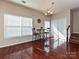 Cozy breakfast nook with hardwood floors, a breakfast table, and lots of natural light from the adjacent window at 14121 Winford Ln, Charlotte, NC 28262