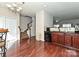 Breakfast nook featuring hardwood floors, a small breakfast table, and a view of the staircase at 14121 Winford Ln, Charlotte, NC 28262