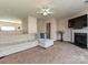 Bright and open living area with modern furniture, fireplace and seamless connectivity to dining area at 14121 Winford Ln, Charlotte, NC 28262