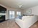 Bright living room features fireplace, sliding doors to outdoor deck, and a cozy sectional sofa at 14121 Winford Ln, Charlotte, NC 28262