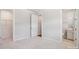 Bright bedroom with an open doorway to the ensuite bathroom and a walk-in closet at 15009 Brownleigh Ln # 26, Huntersville, NC 28078