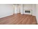 Neutral bedroom with a cozy fireplace, white trim, and hardwood floors for a modern, comfortable feel at 15009 Brownleigh Ln # 26, Huntersville, NC 28078