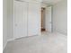 Neat bedroom with double closet, neutral carpet, and plenty of sunlight, ideal for a restful sleep at 15009 Brownleigh Ln # 26, Huntersville, NC 28078