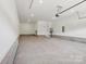 Spacious garage featuring ample room for parking and storage with bright overhead lighting at 15009 Brownleigh Ln # 26, Huntersville, NC 28078