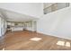 An open-concept living room features wood floors and connects to a gourmet kitchen and the staircase at 15009 Brownleigh Ln # 26, Huntersville, NC 28078
