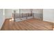 Upper hallway features wood floors, wooden banisters, and an open and airy feel at 15009 Brownleigh Ln # 26, Huntersville, NC 28078