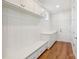 Well-organized mudroom with built-in bench, storage cabinets, countertop, and a doorway at 15009 Brownleigh Ln # 26, Huntersville, NC 28078