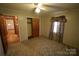 Bedroom with paneled walls features a ceiling fan and a closet at 2427 Rhyneland St, Gastonia, NC 28054