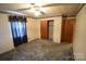 Bedroom features a ceiling fan, a closet, and neutral paint at 2427 Rhyneland St, Gastonia, NC 28054