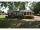 Charming brick home with a well-maintained lawn and mature trees in a desirable neighborhood at 2427 Rhyneland St, Gastonia, NC 28054