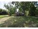 Brick home with a spacious yard, mature trees, and a convenient storage shed in a tranquil setting at 2427 Rhyneland St, Gastonia, NC 28054