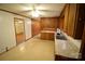 View of eat-in kitchen features wood cabinets and a double sink at 2427 Rhyneland St, Gastonia, NC 28054
