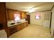 Traditional kitchen features wood cabinets, a double sink, and a vintage dishwasher at 2427 Rhyneland St, Gastonia, NC 28054