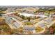 Picturesque aerial view of a neighborhood featuring townhomes and green spaces with fall foliage at 5540 Stafford Rd # 31, Charlotte, NC 28215