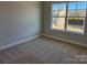 Bedroom with carpet floor and a large window at 5540 Stafford Rd # 31, Charlotte, NC 28215
