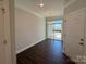 Dining area with hardwood floors, slider door to exterior, and overhead lighting at 5540 Stafford Rd # 31, Charlotte, NC 28215