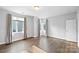 Bright bedroom with hardwood floors and large windows at 916-A Westbrook Dr, Charlotte, NC 28202